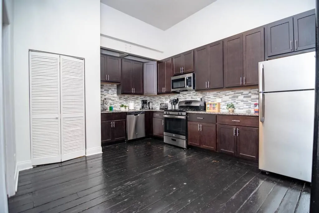 Image 2 of McCormick Pl HUGE 4Br 2Ba with Pool table and optional parking/ sleeps 10